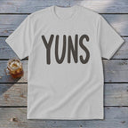 White t-shirt with "YUNS" printed in large, dark grey letters.