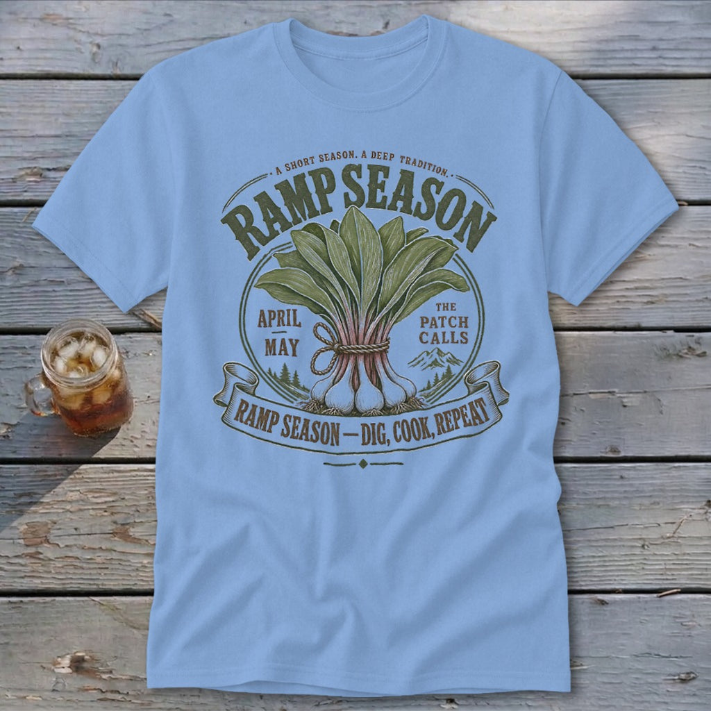 Light blue t-shirt with "Ramp Season Dig, Cook, Repeat" graphic and illustration.