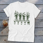 White t-shirt featuring a dark green graphic of four mason jar vases with flowers on a wooden shelf.