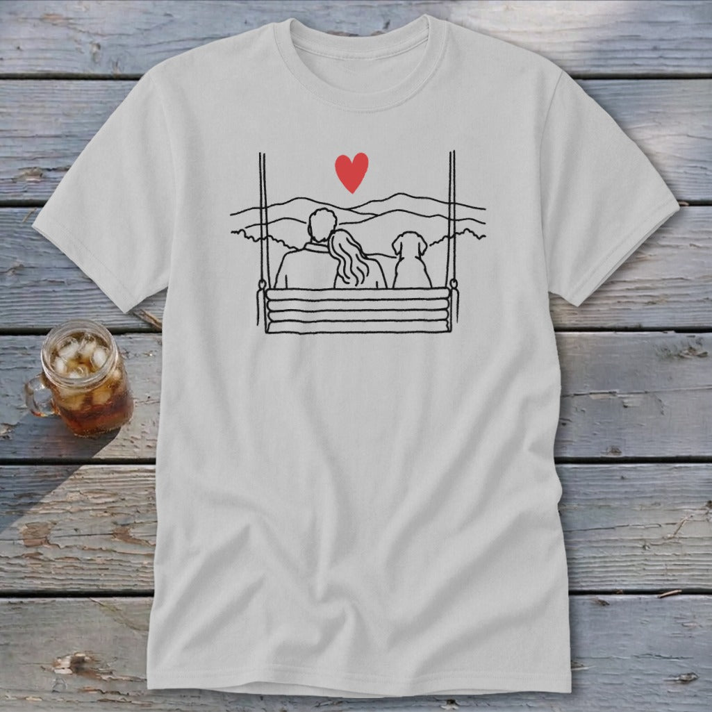 Couple and dog on a swing, overlooking mountains with a red heart.