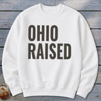 White sweatshirt with large dark gray text that reads "OHIO RAISED".