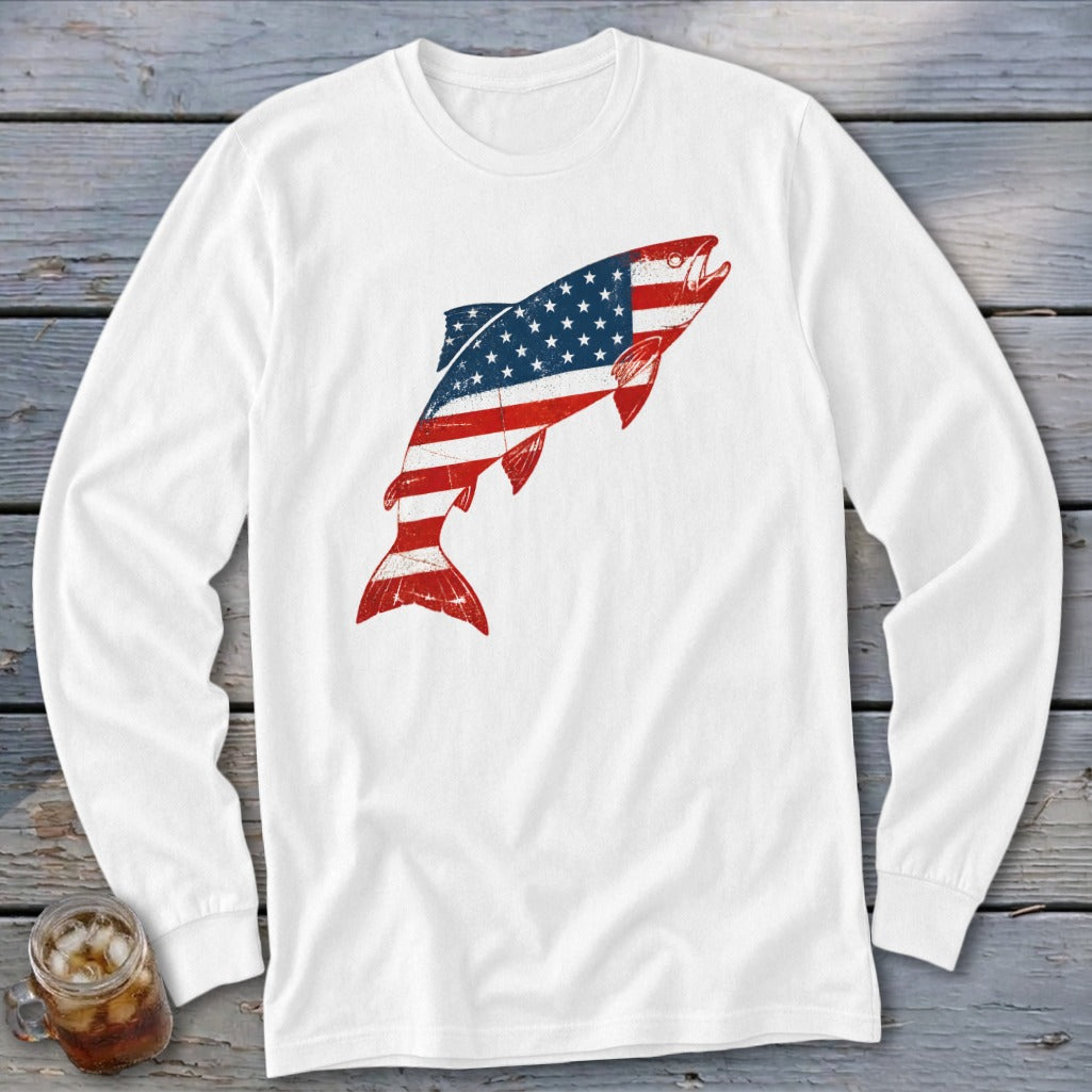 A white long-sleeved t-shirt featuring a jumping fish graphic styled with the American flag.