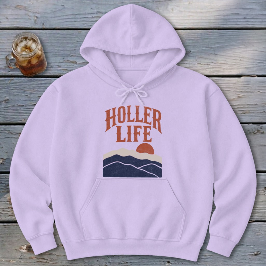 A light purple hooded sweatshirt with front pocket and a retro mountain and sun graphic featuring the text HOLLER LIFE.