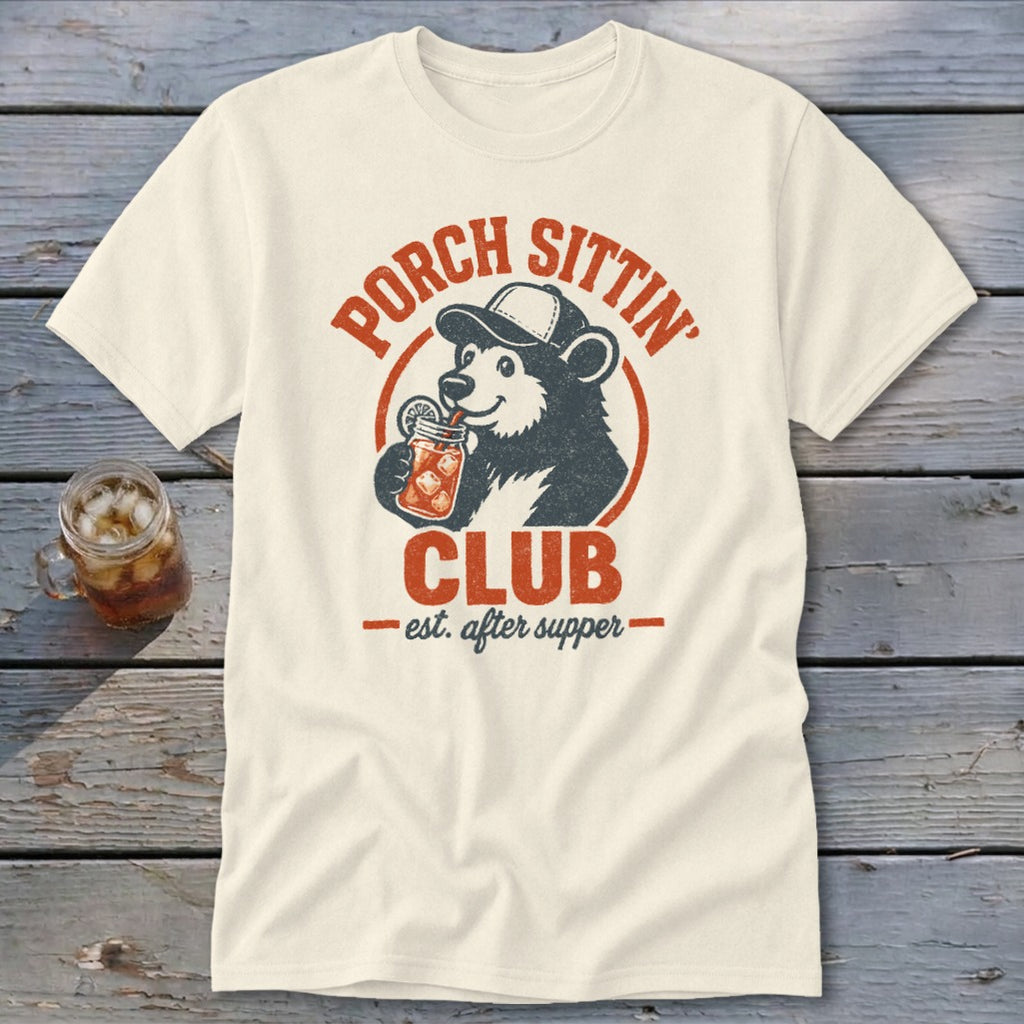 Cream t-shirt featuring a bear in a baseball cap drinking from a jar, with "Porch Sittin' Club est. after supper" text.