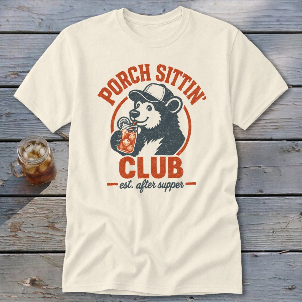 Cream t-shirt featuring a bear in a baseball cap drinking from a jar, with "Porch Sittin' Club est. after supper" text.