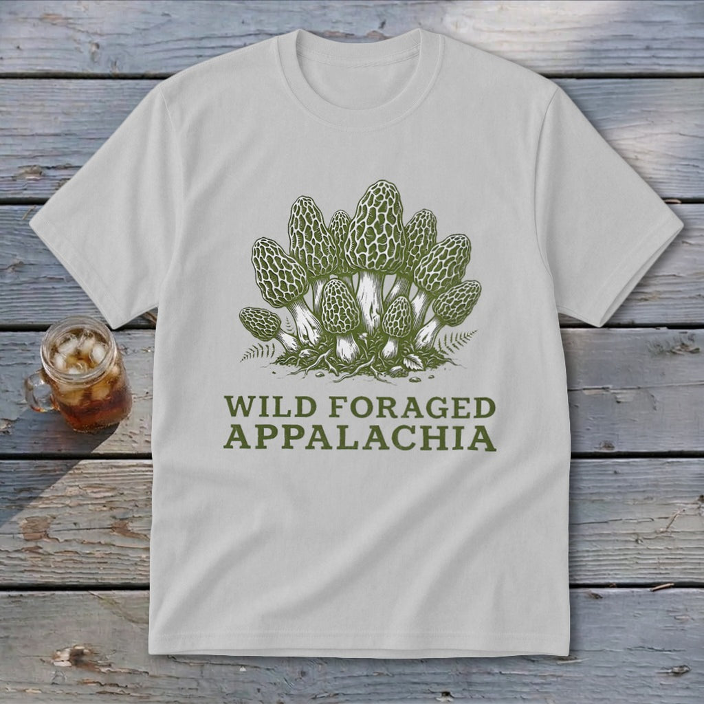 White t-shirt with green illustration of morel mushrooms and text "WILD FORAGED APPALACHIA".