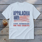 A light blue t-shirt printed with the word Appalachia above a distressed American flag and the text 13 states one mountain range one free country.