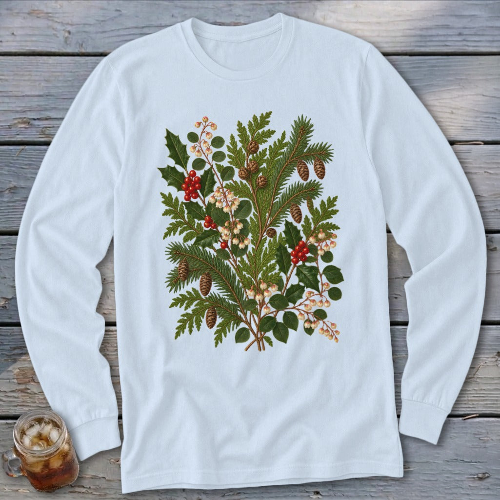 White long-sleeve t-shirt with a central print of evergreen branches, holly, and pinecones.