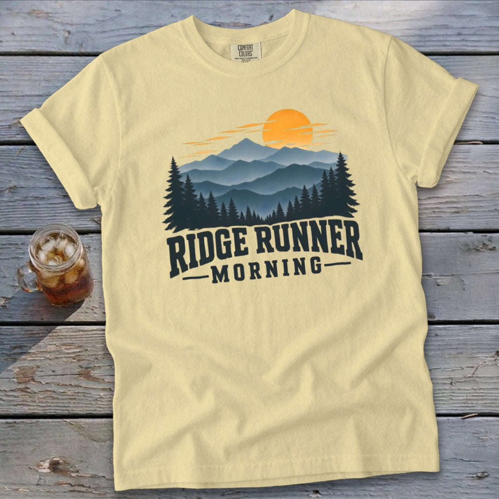 Pale yellow t-shirt with mountain and sunrise graphic, reading "RIDGE RUNNER MORNING".