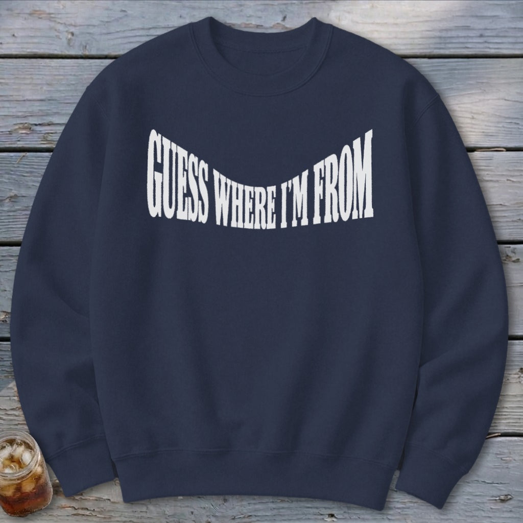 Navy crewneck sweatshirt with white text "GUESS WHERE I'M FROM".
