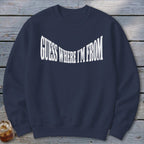 Navy crewneck sweatshirt with white text "GUESS WHERE I'M FROM".
