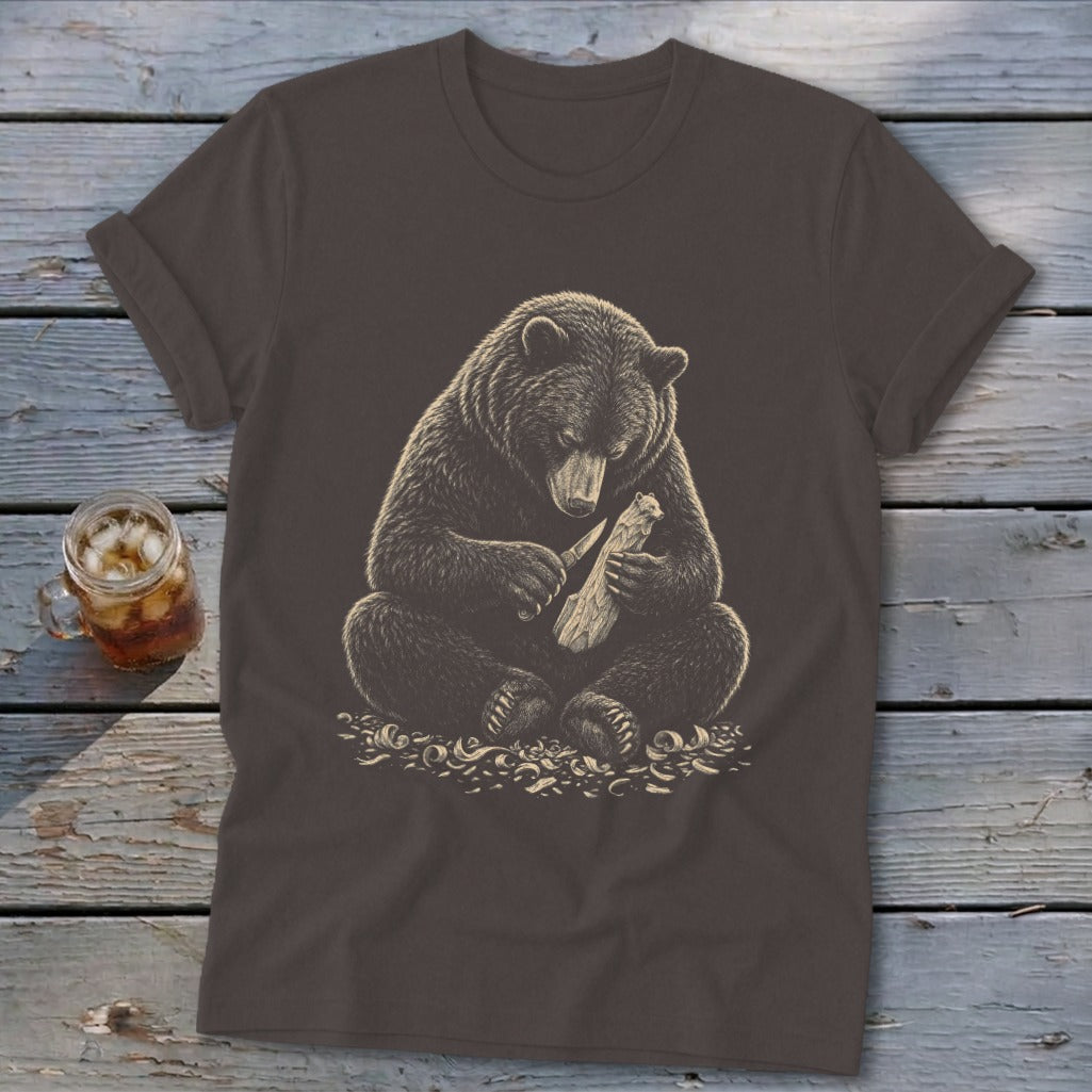 Brown t-shirt with detailed illustration of a bear carving wood.
