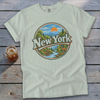 T-shirt with "New York" text over a circular landscape of mountains, river, and deer.