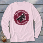 Light pink long-sleeve t-shirt with a maroon graphic featuring a bear relaxing on a porch swing.