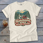 Cream t-shirt with "Homebound for the Mountain Christmas" graphic featuring a truck and mountains.
