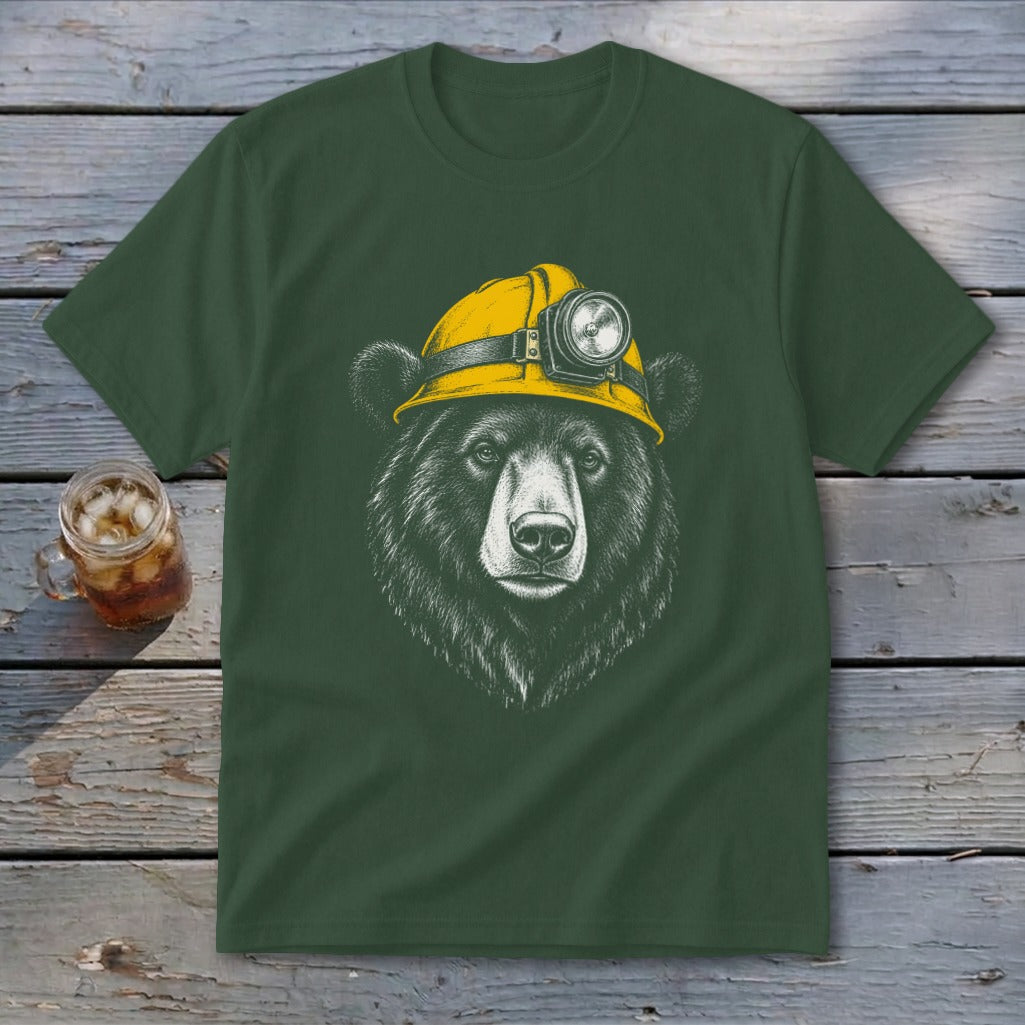 Bear wearing a yellow hard hat with a headlamp printed on a dark green t-shirt.
