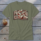 An olive green crewneck t-shirt featuring a graphic print of a quilt blending into a mountain landscape.