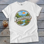 White t-shirt with circular Pennsylvania landscape graphic featuring deer and river.