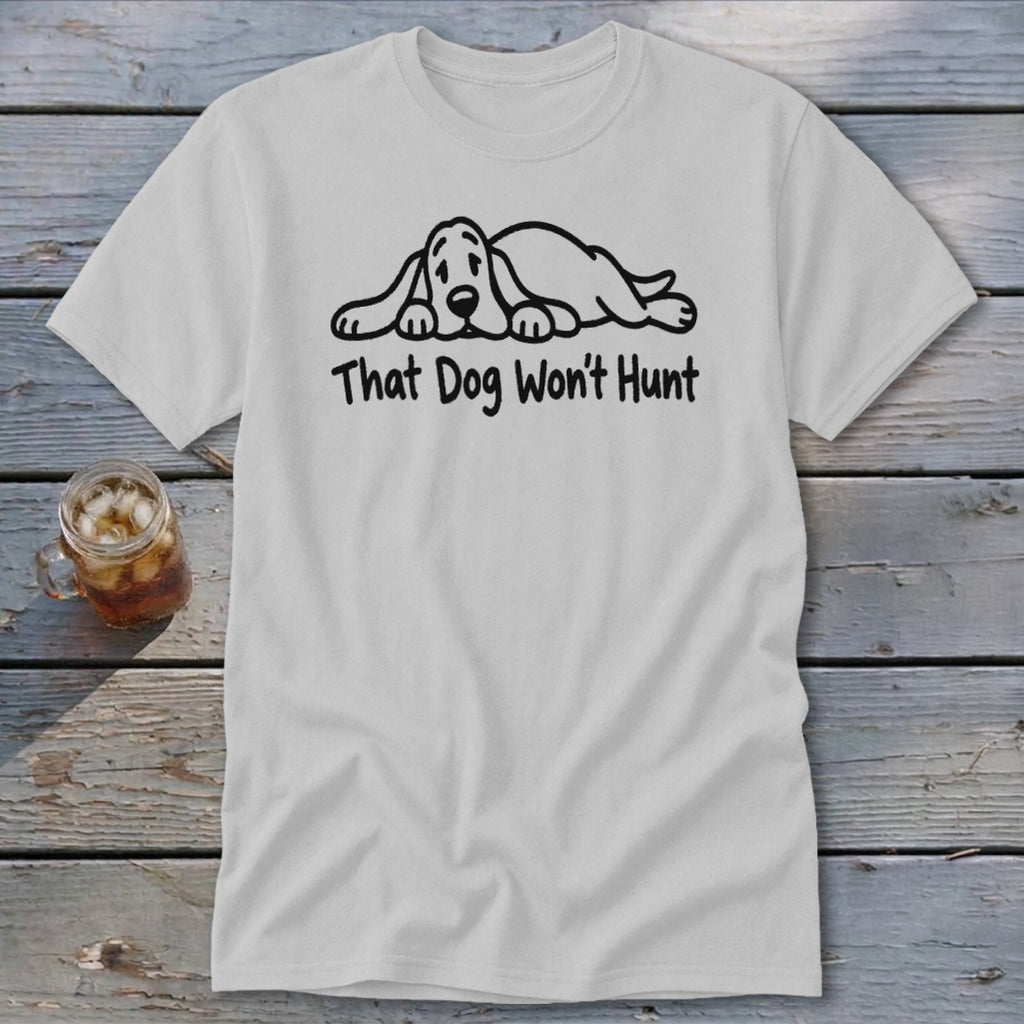 A light gray t-shirt with a cartoon illustration of a sleeping dog and the text That Dog Won't Hunt.