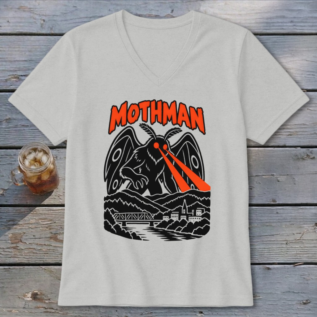 Mothman graphic on a light grey t-shirt with orange text and red eye beams.