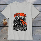 Mothman graphic on a light grey t-shirt with orange text and red eye beams.