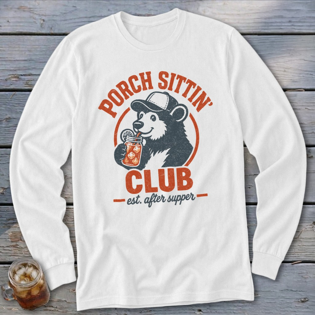 White long sleeve shirt with a graphic of a bear drinking from a jar, "Porch Sittin' Club" text.