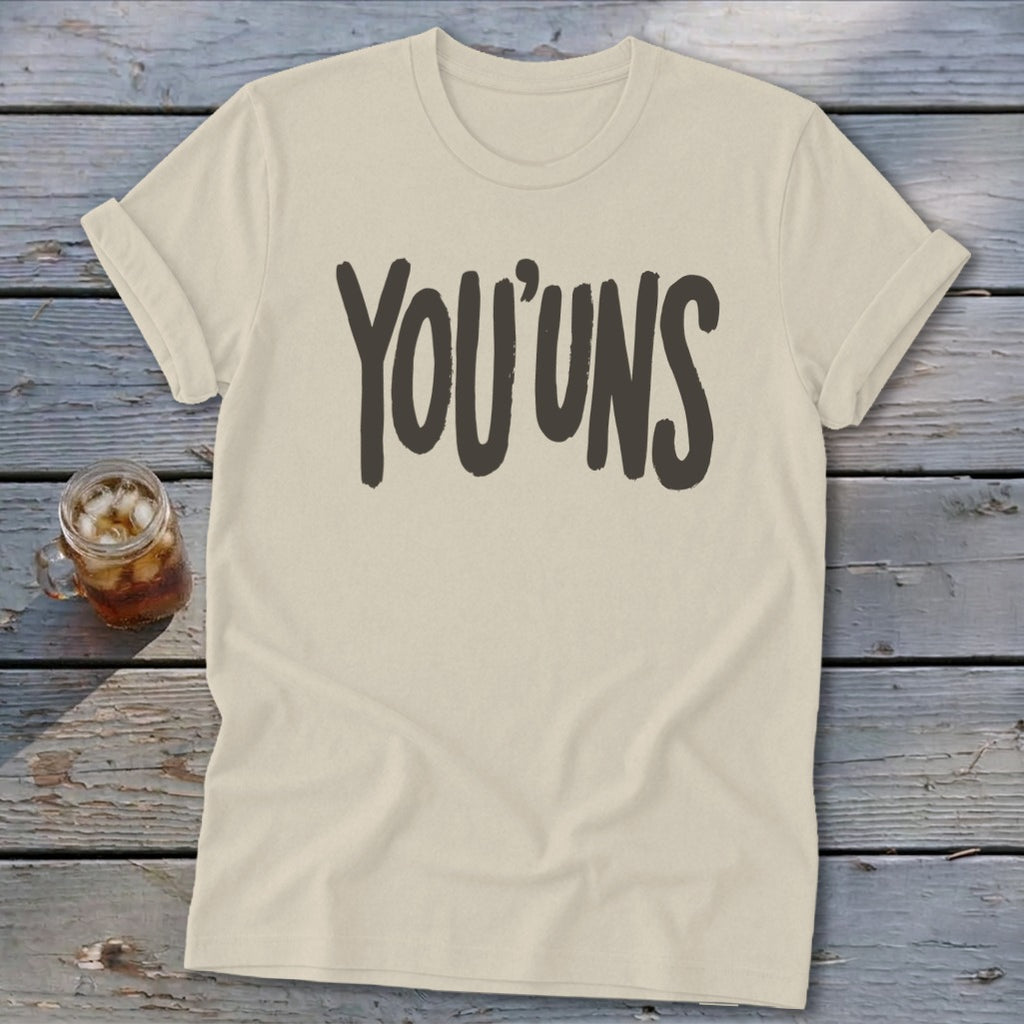 Light-colored t-shirt with "YOU'UNS" printed in dark text.