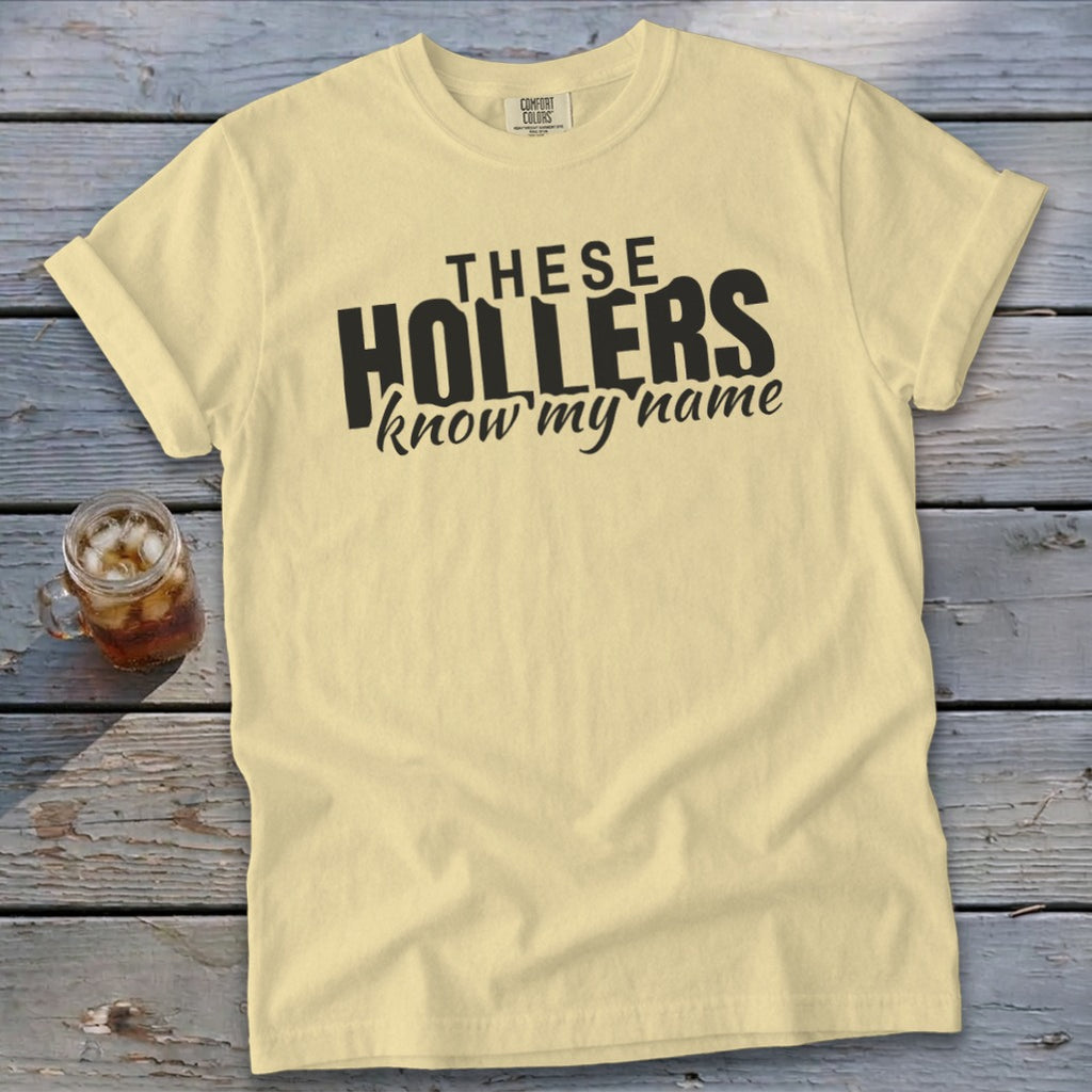 Yellow t-shirt with black text that reads "THESE HOLLERS know my name".
