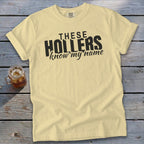 Yellow t-shirt with black text that reads "THESE HOLLERS know my name".