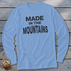 Light blue long-sleeve shirt with black "MADE IN THE MOUNTAINS" text.