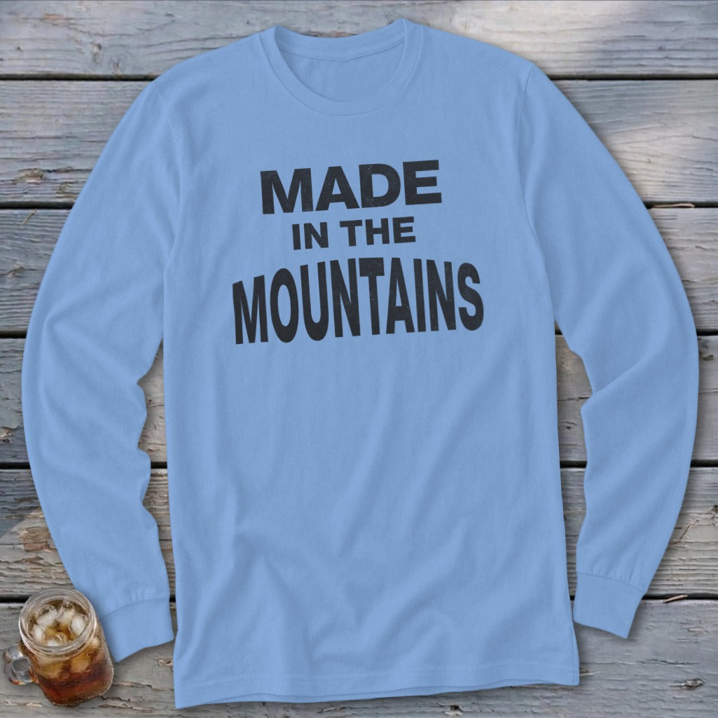 Light blue long-sleeve shirt with black "MADE IN THE MOUNTAINS" text.