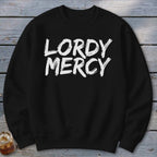 Black crewneck sweatshirt with white "LORDY MERCY" text in distressed brush strokes.
