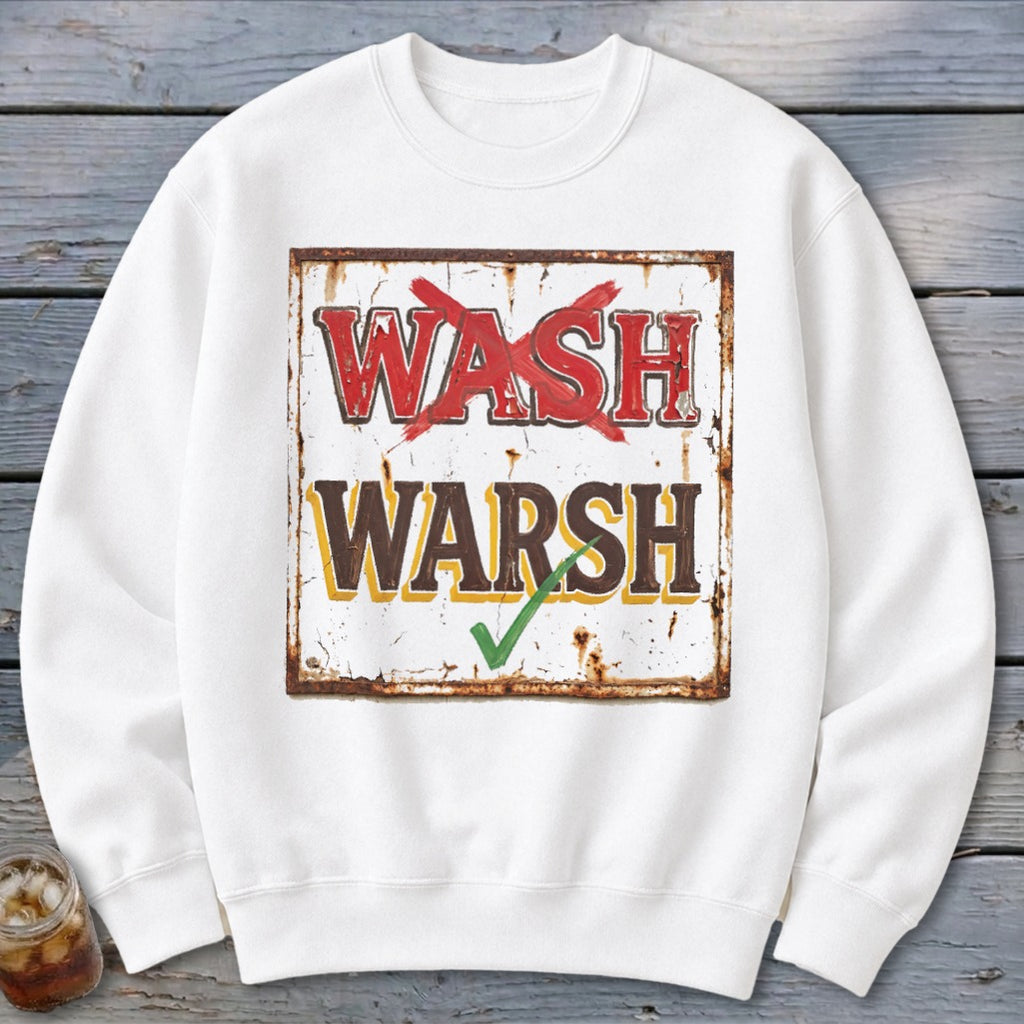 White crewneck sweatshirt featuring a graphic of a distressed sign with red text wash crossed out and brown text warsh checked with green.