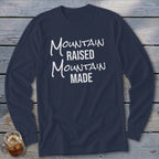 Navy long sleeve shirt with white text reading "Mountain Raised Mountain Made."