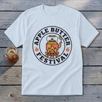 White t-shirt with circular "Apple Butter Festival" logo featuring a kettle over a campfire.