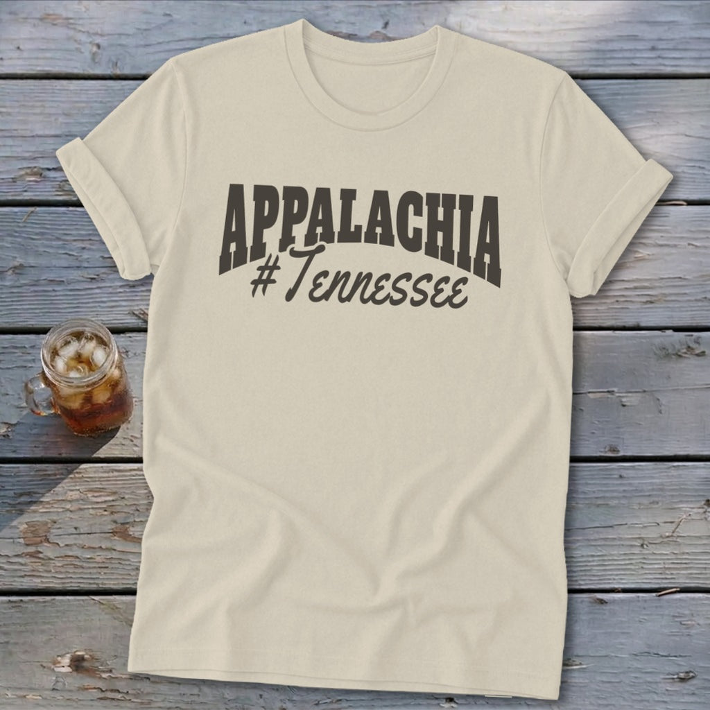 Cream t-shirt with "APPALACHIA #Tennessee" graphic, on a wooden surface.
