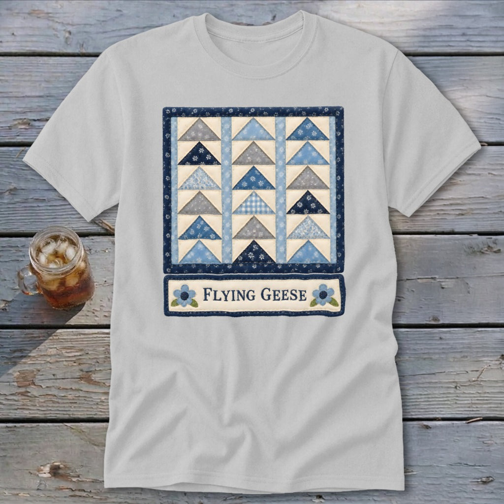 Light grey t-shirt featuring a quilt block design with blue and grey triangles and the text "Flying Geese".
