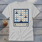 Light grey t-shirt featuring a quilt block design with blue and grey triangles and the text "Flying Geese".