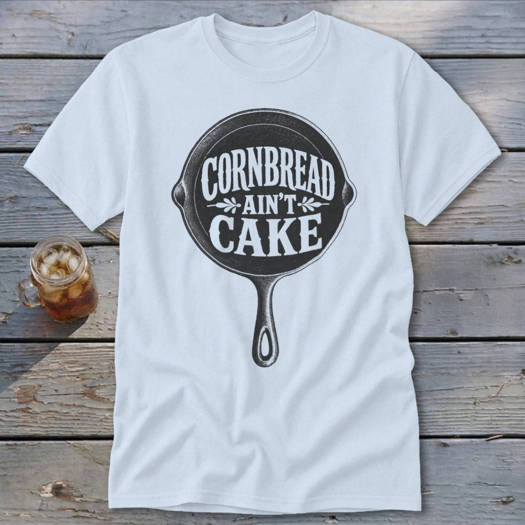 White t-shirt with a cast iron skillet graphic reading "Cornbread Ain't Cake."