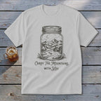 Light gray t-shirt with a jar graphic containing a mountain scene and the text Carry The Mountains With You.