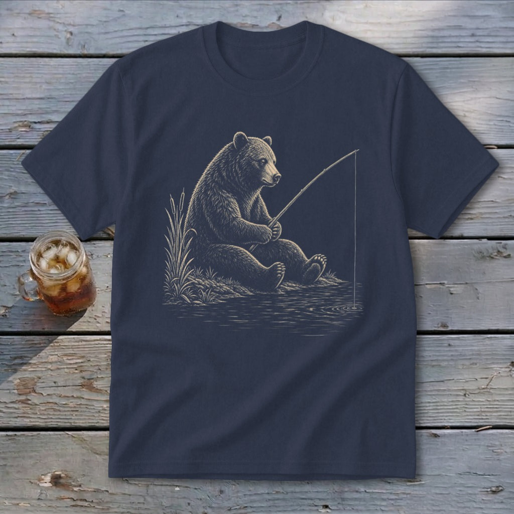 Navy t-shirt with a dark brown bear fishing by the water.