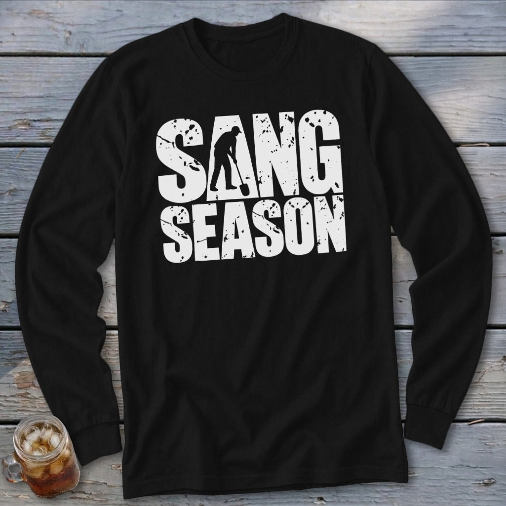 A black long-sleeve t-shirt features distressed white text that reads SANG SEASON with a silhouetted digger.