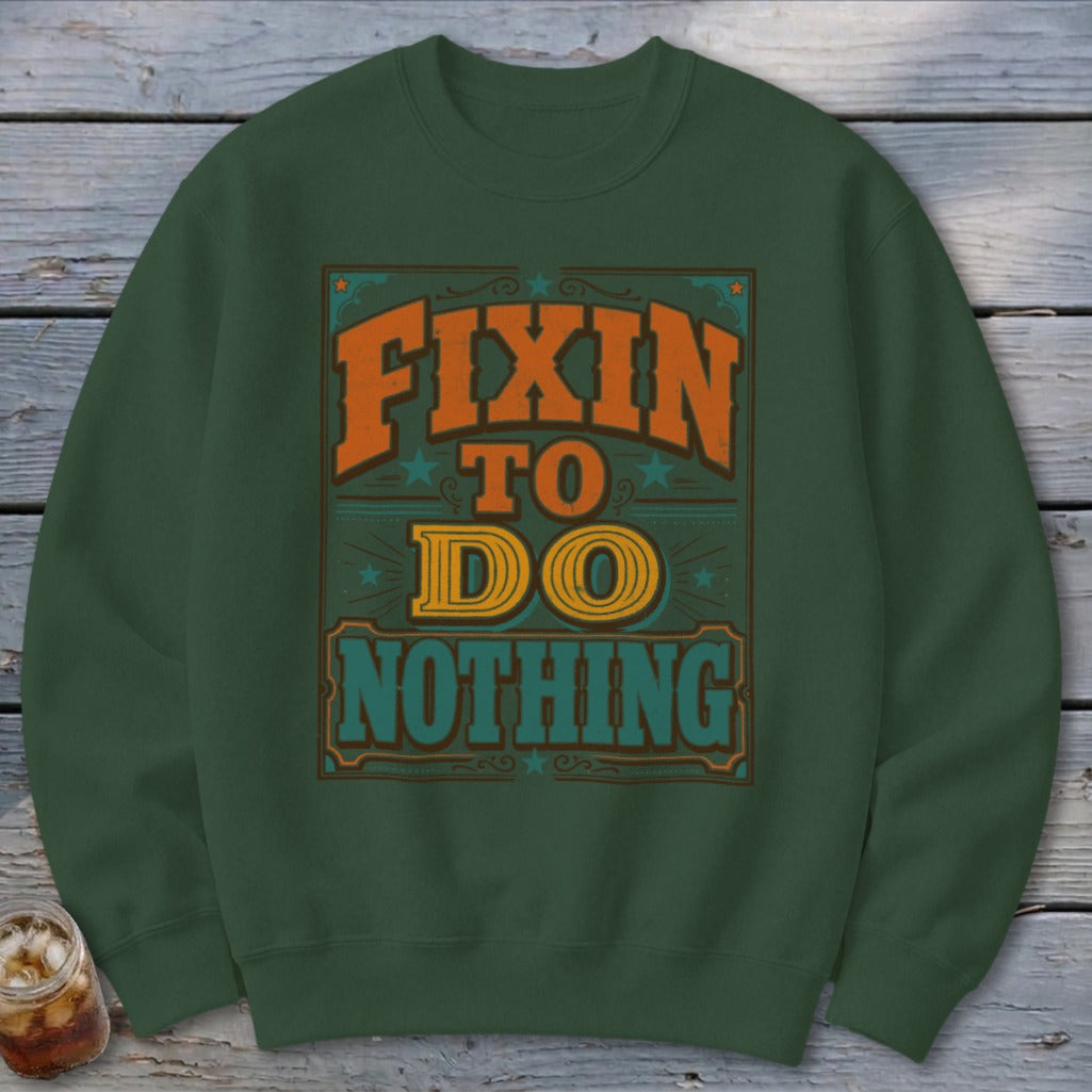 Green sweatshirt with "Fixin' To Do Nothing" vintage-style text design.
