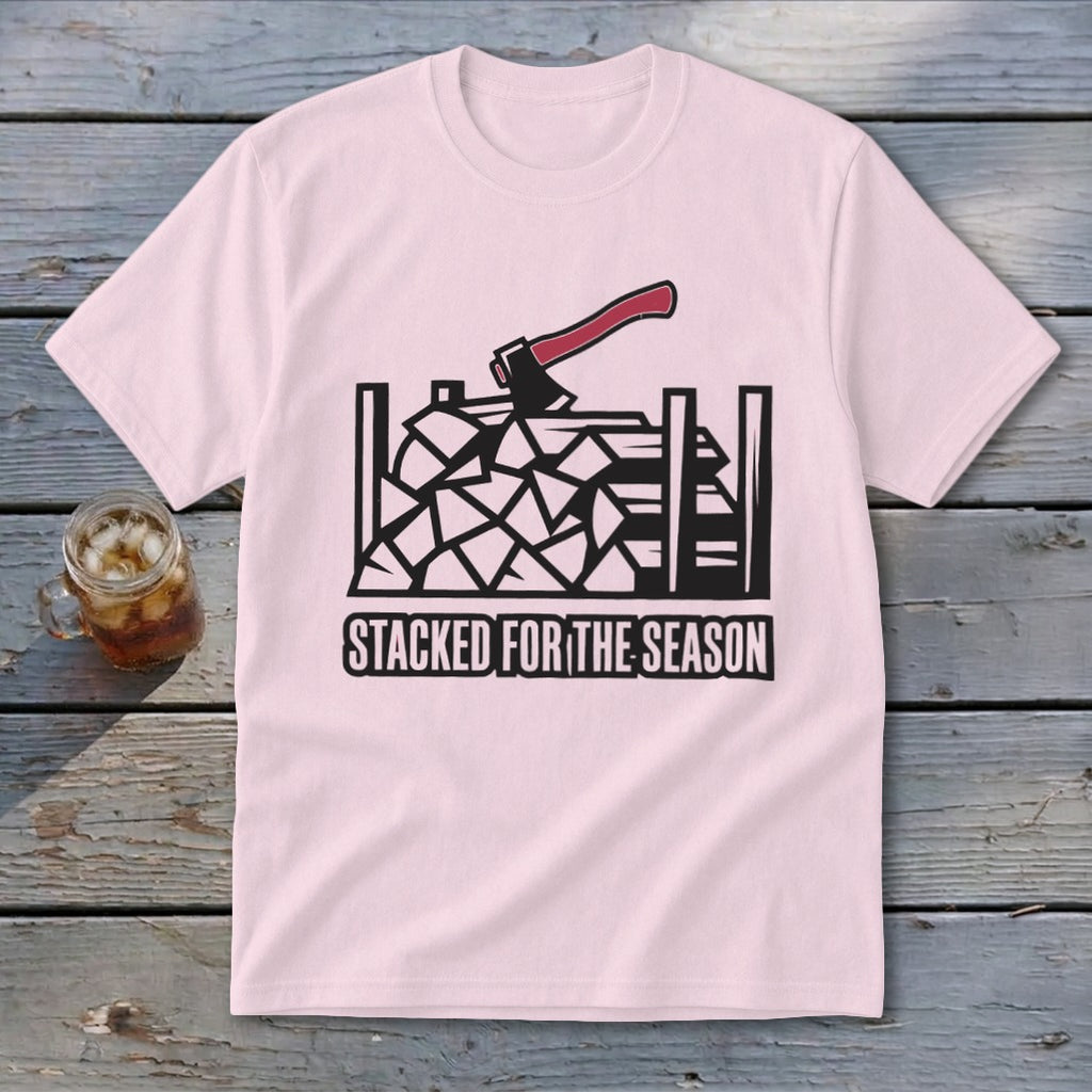 Pink t-shirt with black graphic of stacked firewood and axe, text "STACKED FOR THE SEASON".