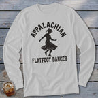 A light gray long-sleeve t-shirt featuring a black silhouette of a dancing woman and the text Appalachian Flatfoot Dancer.