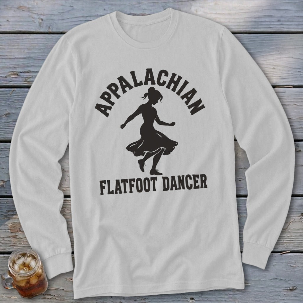A light gray long-sleeve t-shirt featuring a black silhouette of a dancing woman and the text Appalachian Flatfoot Dancer.