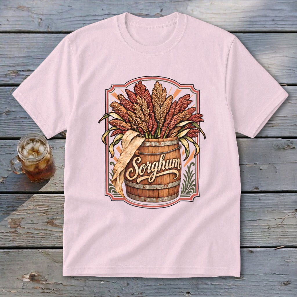 Pink t-shirt with a graphic of a wooden barrel overflowing with sorghum and the word "Sorghum."