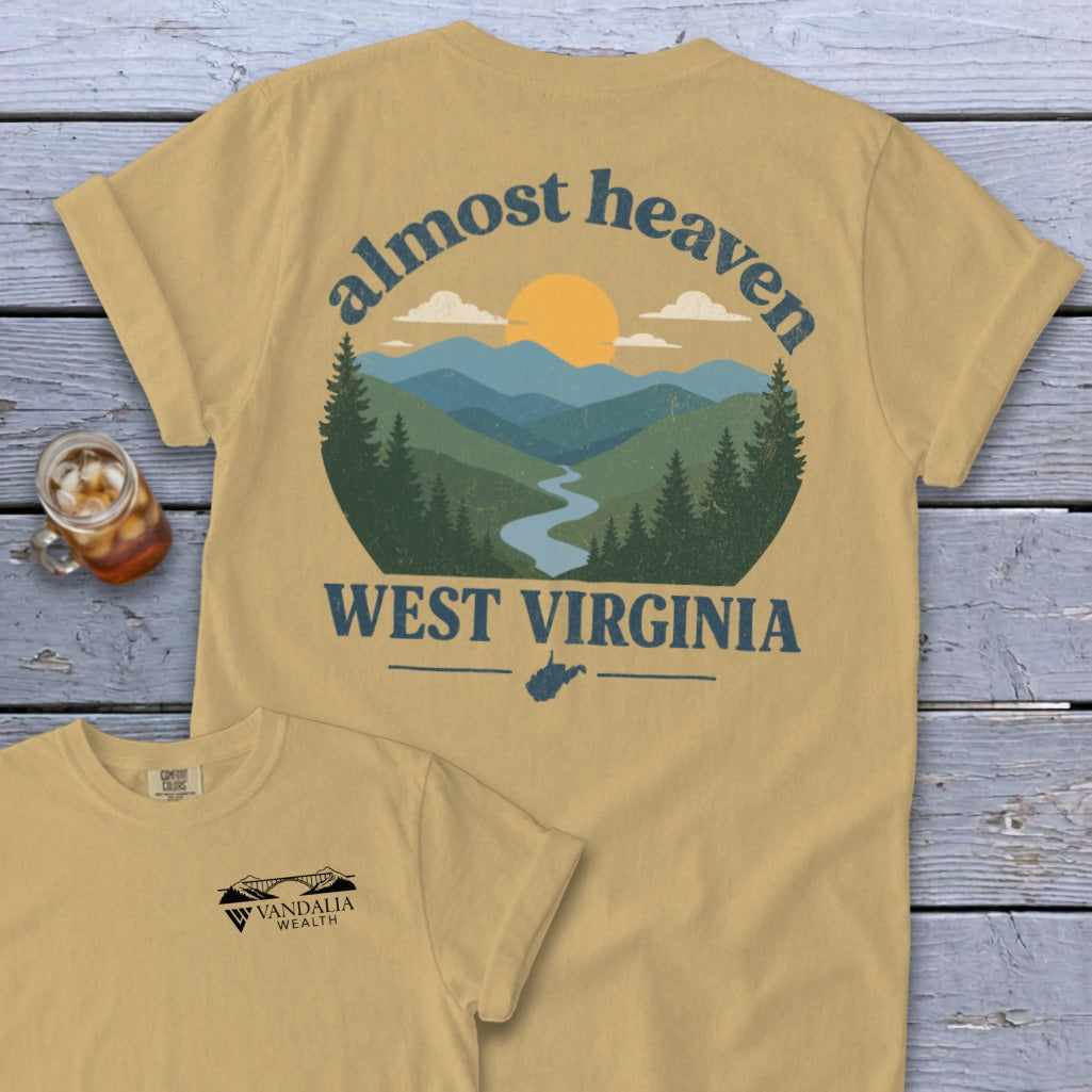 T-shirt with "almost heaven WEST VIRGINIA" mountain landscape design and smaller logo.