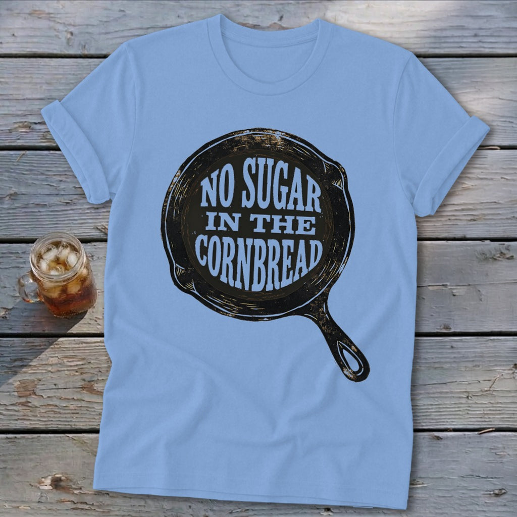 Light blue t-shirt with black skillet graphic reading "No Sugar In The Cornbread."