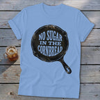 Light blue t-shirt with black skillet graphic reading "No Sugar In The Cornbread."
